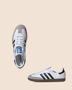 Adidas Samba classic white sneakers with black stripes and grey suede toe detailing, shown from top and side angles on a neutral background.